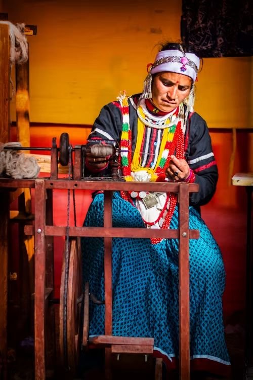 A woman artisan operating a traditional handloom